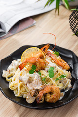 Pasta Tagliatelle with prawns and chanterelles mushrooms