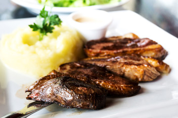 juicy steak veal beef meat with tomato and potatoes