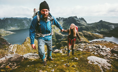 Backpackers Couple holding hands hiking in mountains Travel Lifestyle wanderlust concept family...