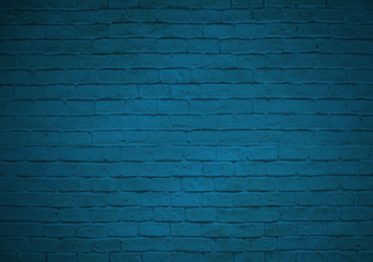 Empty blue brick wall backgroud faded on black