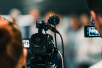 Camera at media conference