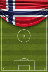 Fototapeta premium Norway country flag draped over a football soccer pitch. 3D Rendering