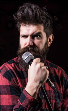 Musician, singer singing in music hall, club.