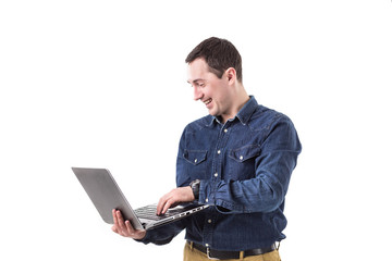 young programmer holding a laptop in hands isolated on white background. Copy space