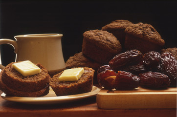Date Bran Muffins Pictured with Dried Dates, Coffee Cup and Plate 