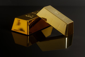 Gold bullion on black background