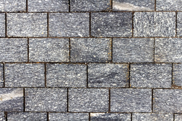 Granite bricks texture close-up. Texture of natural granite stone