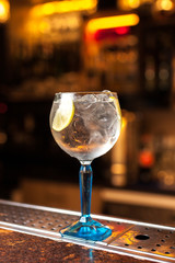 Cocktail with lemon in bar