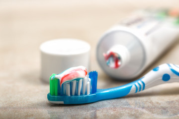toothbrush and toothpaste on the shelf