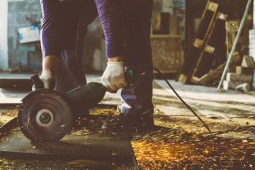 Saw cut iron sheet in the shop for the manufacture of iron structures