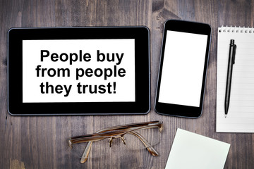 People buy from people they trust! Text on tablet device