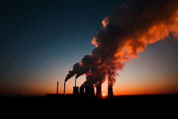 Fototapeta na wymiar coal fired power station silhouette at sunset, Pocerady, Czech republic