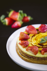 Homemade cream layer cake, fresh, colorful, and delicious dessert with juicy strawberries.