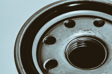 Monochrome background image of oil filter close up. Artwork from auto part in macro photography.