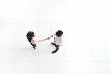 Top view of Asian business people shake hand together