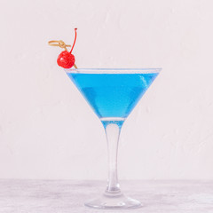 Blue Curacao cocktail decorated with fruit.