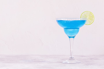 Blue Curacao cocktail decorated with fruit.