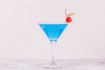 Blue Curacao cocktail decorated with fruit.