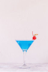Blue Curacao cocktail decorated with fruit.
