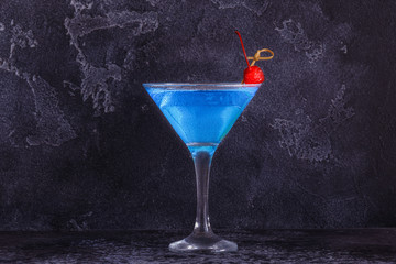 Blue Curacao cocktail decorated with fruit.
