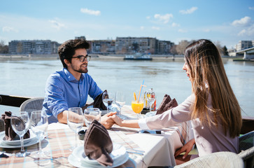 Young love couple on a romantic date at a cafe. Outdoors, love, romance