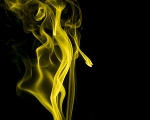 Yellow smoke on black background