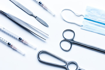 instruments for cosmetic surgery on white background top view