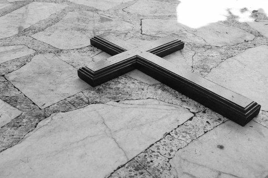 The wooden cross on the white background .Crucifixion Of Jesus Christ.Holy cross.Easter and Good friday concept.Worship God concept.Black and white Tone.