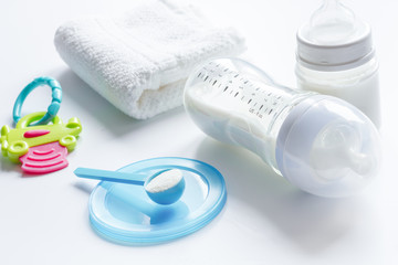 preparation of mixture baby feeding on white background