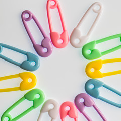 Baby safety pins background