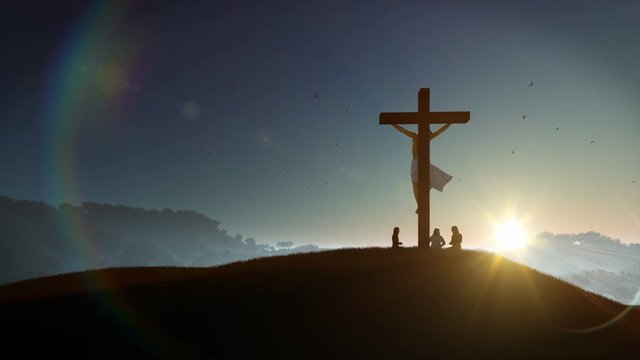 Christians praying at Jesus cross at sunset, 4K