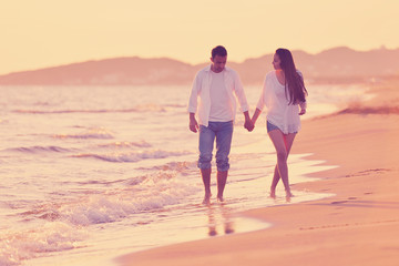 Fototapeta na wymiar young couple on beach have fun