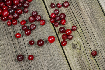Still-life with cranberries on a wooden table