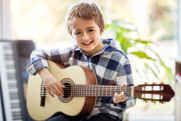 Boy playing acoustic guitar © Brian Jackson