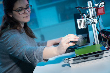 young woman  design printing of the metamaterials on a 3D printer