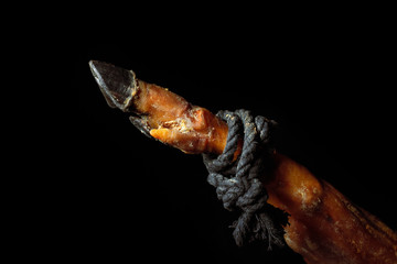 part of the surface of the ham with a black worn hoof confirming the quality of the well-known Spanish ham from the breed of pigs Pata Negra. 