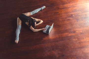 Young ballerina with laptop © AboutLife