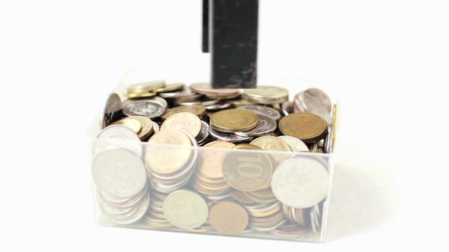 Magnet attracts the coin. Magnetic power withdraw from a box the money