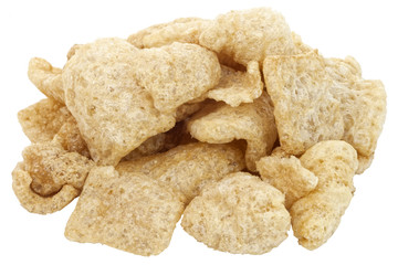 Isolated pile of pork rinds, cracklings or chicharones.