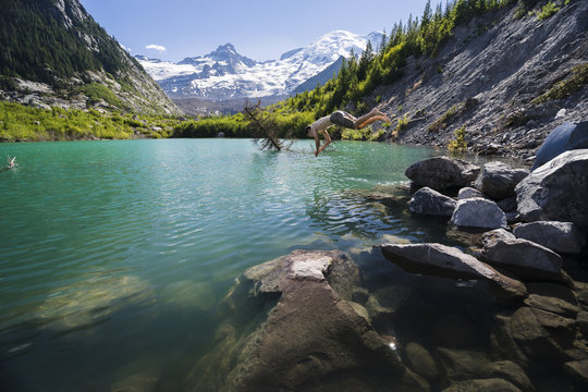 Side view of man diving in river at Mount Rainier National Park