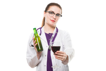 Attractive caucasian brunette female doctor standing in office with bottle and glass of wine in her hands on white background