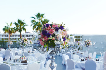 Beautiful delicate wedding decoration with roses and eustoma
