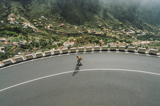 High angle view of man skating on mountain road