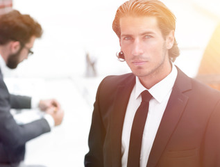 businessman standing in his office