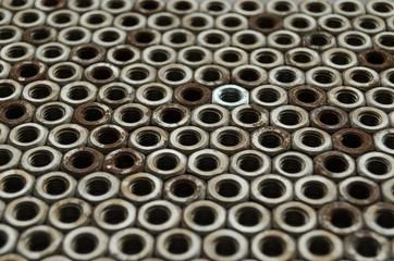 Background of metal mounting nuts.