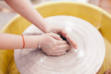 hands with clay