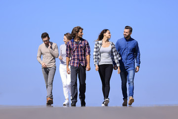 team of young people walking along the road.outdoors