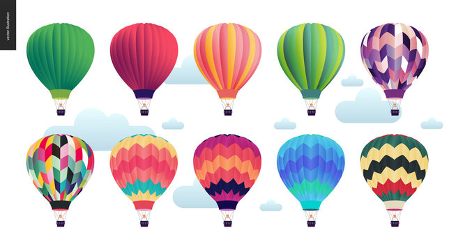 Hot air balloons - set of various colored balloons in the sky with clouds