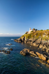 Fototapeta na wymiar Lighthouse on the coast in Cudillero, Spain