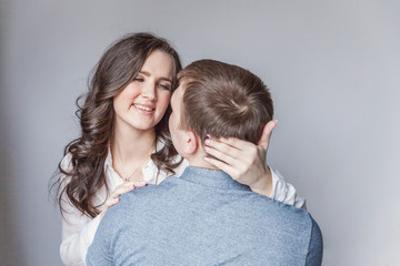 Couple in love having nice time together. Young happy woman hugging her handsome boyfriend. Cheerful casual people students having hopes, dreams, goals, bride and groom with family wants and aspiratio